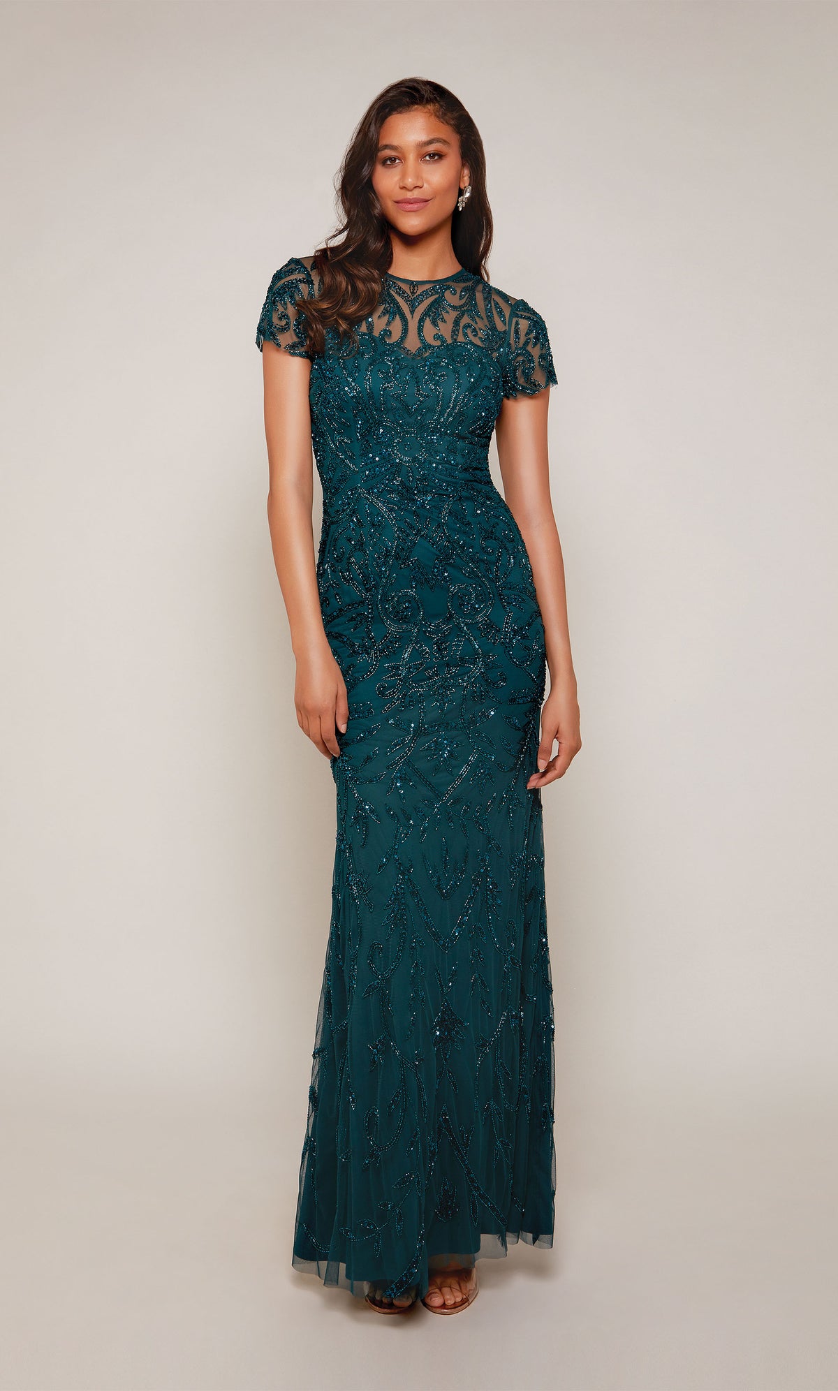 A floor length, hand-beaded evening gown with an illusion neckline and short sleeves in an dark green color called dragonfly. Color-SWATCH_27607__DRAGONFLY