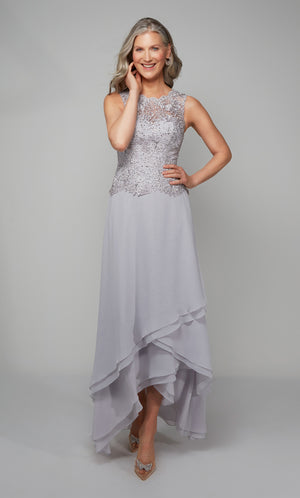 Flowy chiffon formal dress with a lace bodice and tiered skirt in silver.