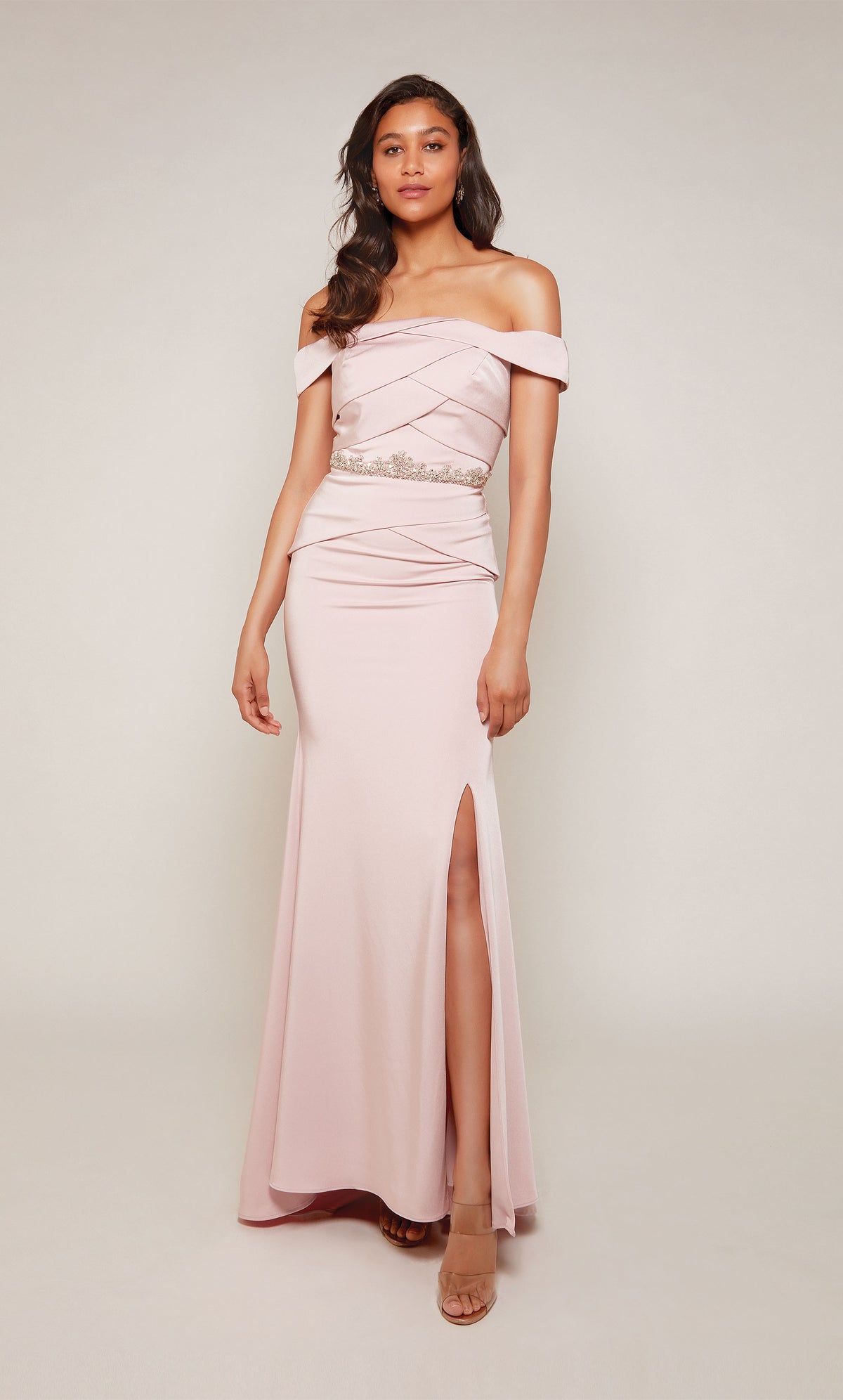 A rosewood colored, off the shoulder evening gown with an pleated bodice, beaded waistline, and side slit. Color-SWATCH_27610__ROSEWOOD