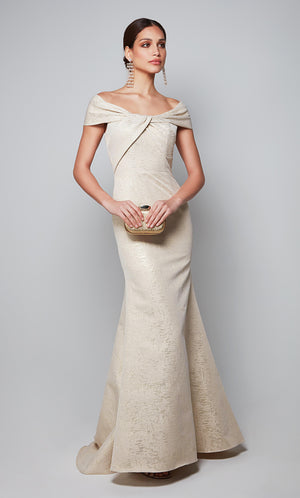 Fit and flare evening dress with a boat neckline, knotted detail, and cap sleeves. Color-SWATCH_27613__CHAMPAGNE-GOLD