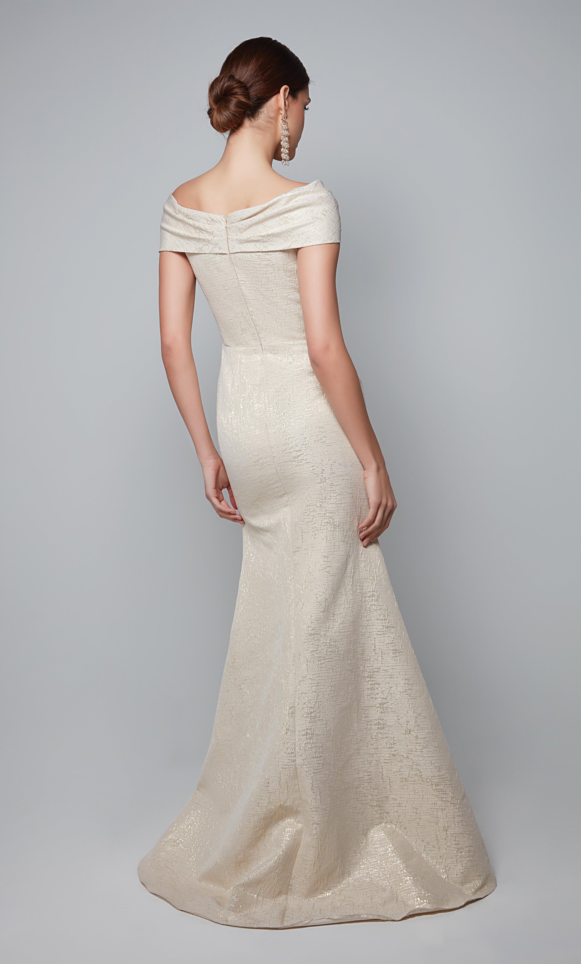 Fit and flare evening dress with a boat neckline, knotted detail, and cap sleeves. Color-SWATCH_27613__CHAMPAGNE-GOLD