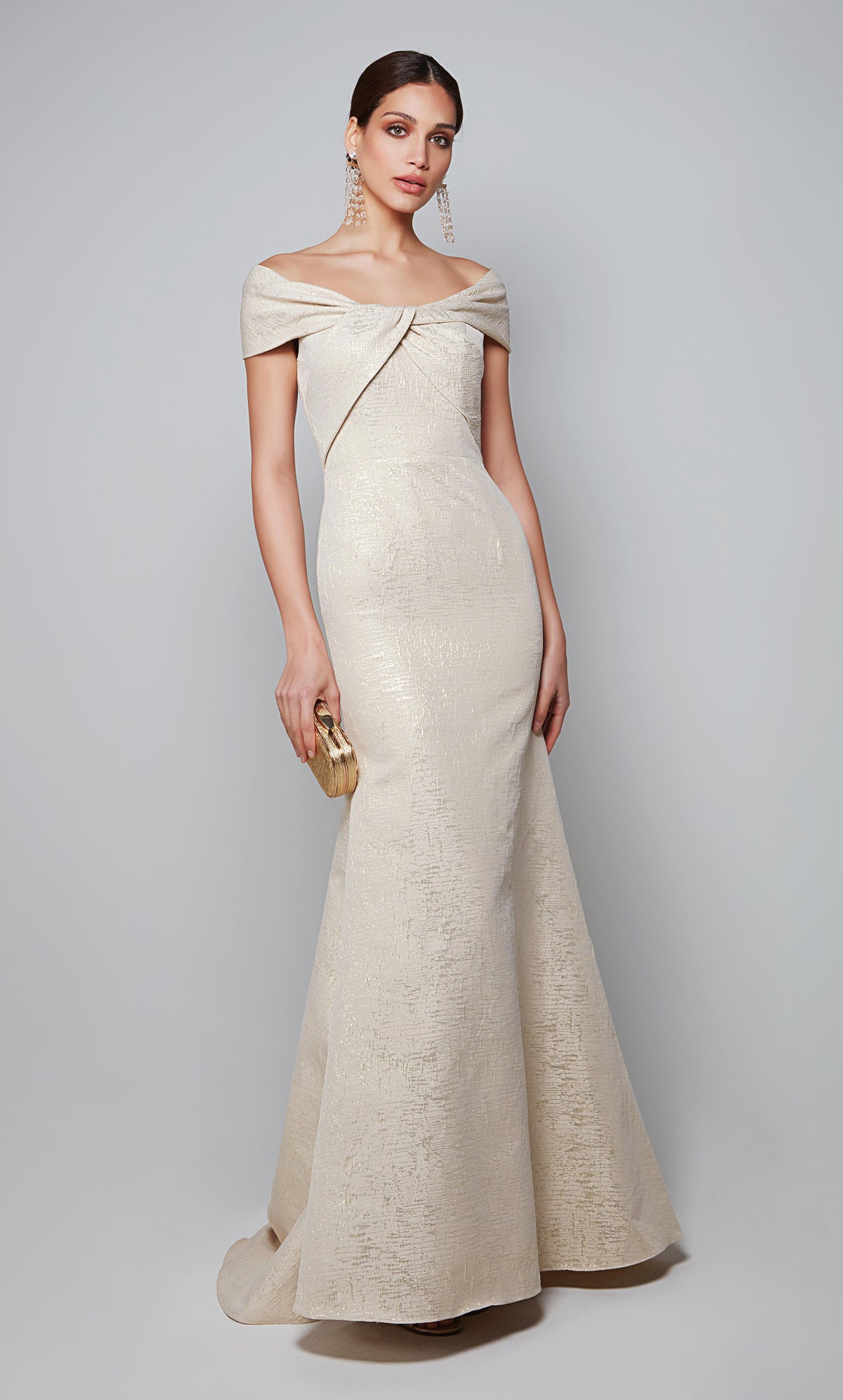 Elegant wedding guest dress with a bateau neckline and fit and flare silhouette in champagne-gold.