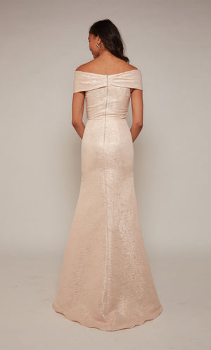 Light coral-gold formal dress with an closed zipper back and fit and flare silhouette.