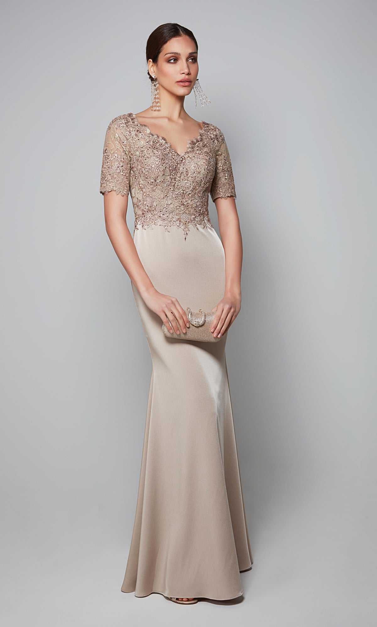 Stretch crepe formal gown with sleeves and a lace bodice in light tan color.