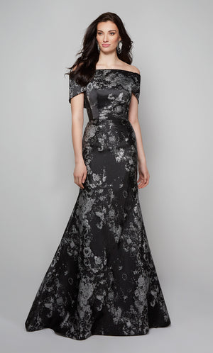 Chic mother of the bride dress featuring a fit and flare silhouette and an off the shoulder neckline in black and silver.