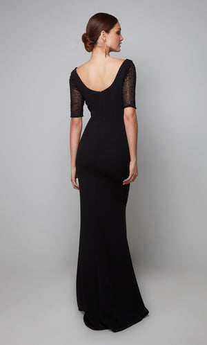 Chic black formal dress with a scoop back, embellished sleeves, and train.
