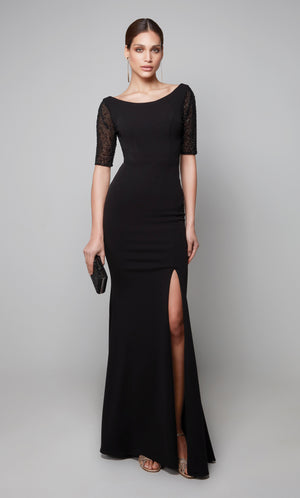 Black evening gown with a scoop neck, embellished sleeves, and side slit.