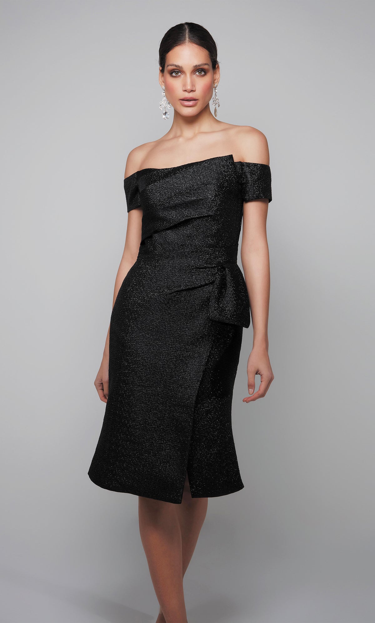 Off the shoulder black midi dress with side slit.