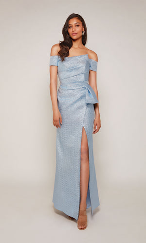 Metallic Jacquard, off the shoulder black tie gown with pleated bodice and side slit in french blue.