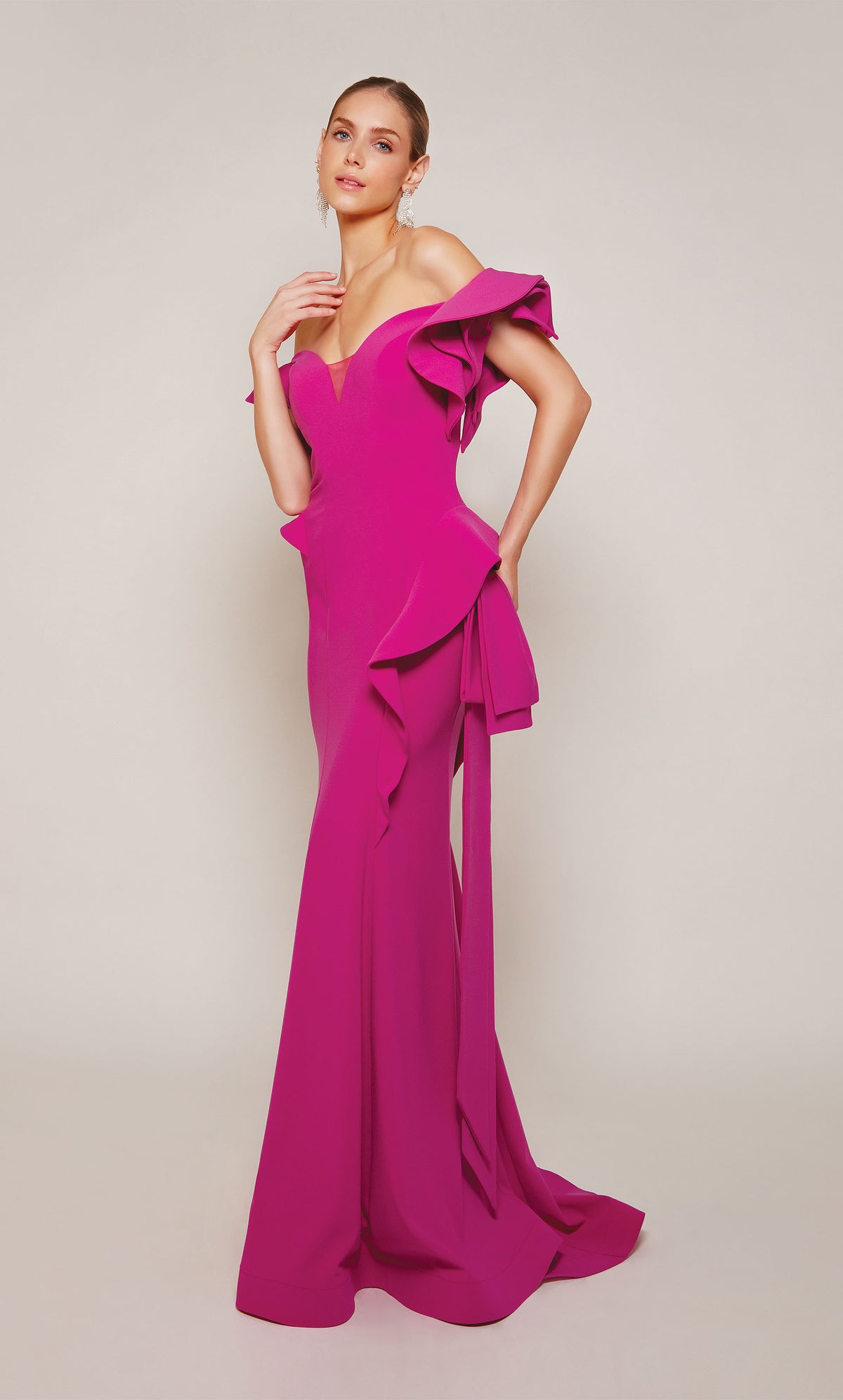 A chic, raspberry pink wedding guest dress boasting an off-the-shoulder neckline, rosette sleeves, and a sheath skirt with cascading ruffles. An excellent choice for a formal evening wedding.