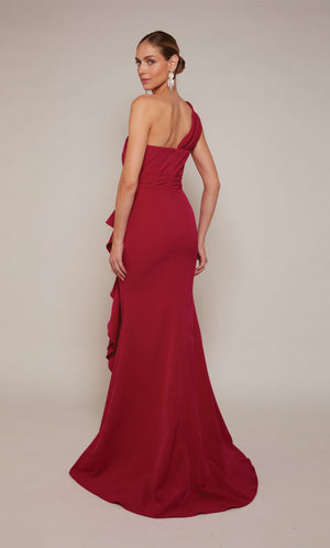 A raspberry pink colored one shoulder evening gown with a zip-up back and a slight train.