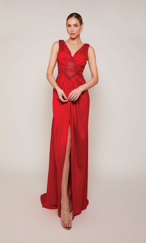 A sleeveless, red satin wedding guest dress with a V-neckline and front slit.
