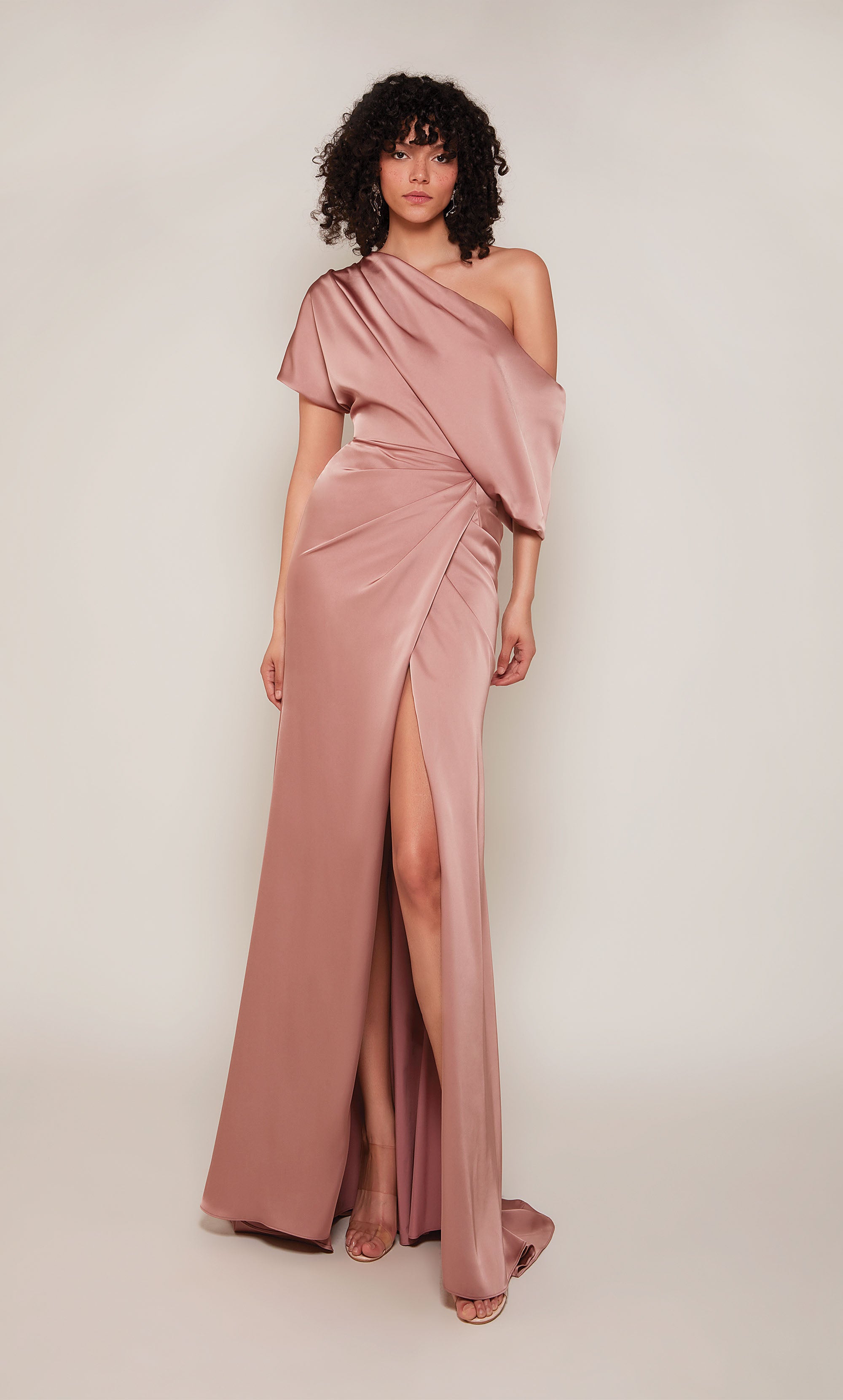 One shoulder satin wedding guest dress with a draped top, a fitted skirt, and a front slit in vintage rose.