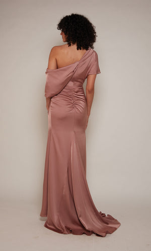 One shoulder satin wedding guest dress with a draped top, a fitted skirt, and a slight train.