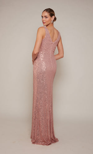 A light mauve, sequin embellished designer gown with a V-shaped back and a zipper closure.