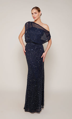A sparkly, hand beaded designer gown with a sheer, draped one shoulder neckline and fitted skirt in navy blue. The dress has a side zipper.