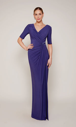 A ruched wedding guest dress with a V-neckline, short sleeves, and a side slit in royal blue.