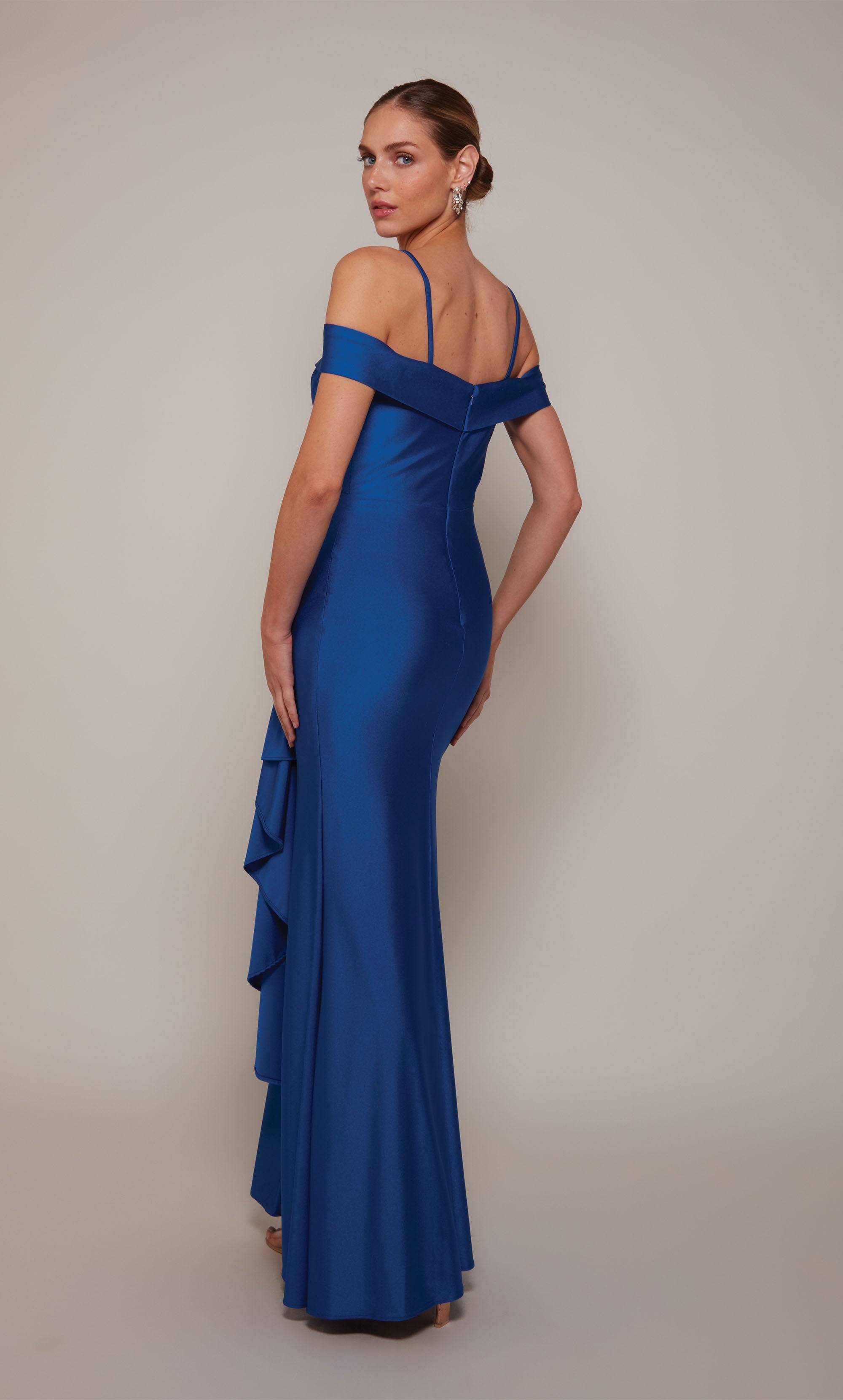 Royal blue off the shoulder long formal dress with spaghetti straps, pleated detail, a side ruffle, and a side slit.