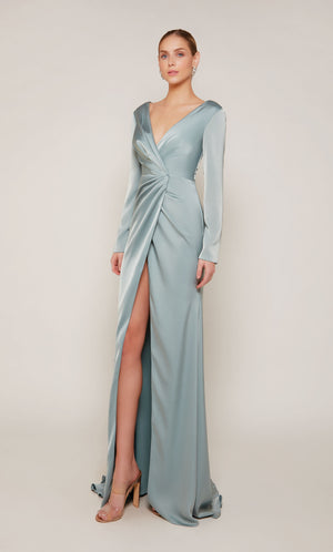 A chic, long sleeve evening gown with a low V-neckline and front slit in a sheen sage green color.