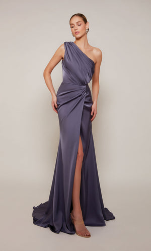 An elegant, satin one shoulder gown with ruching detail and front slit, in a purple-ish grey color called storm cloud.