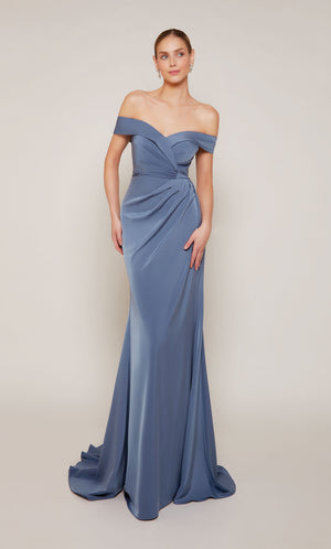 A sophisticated, off-the-shoulder wedding guest dress with a pleated waist and fit and flare silhouette in dark french blue.