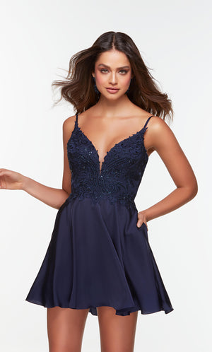 Short girls party dress with a plunging neckline and embellished bodice in midnight blue.