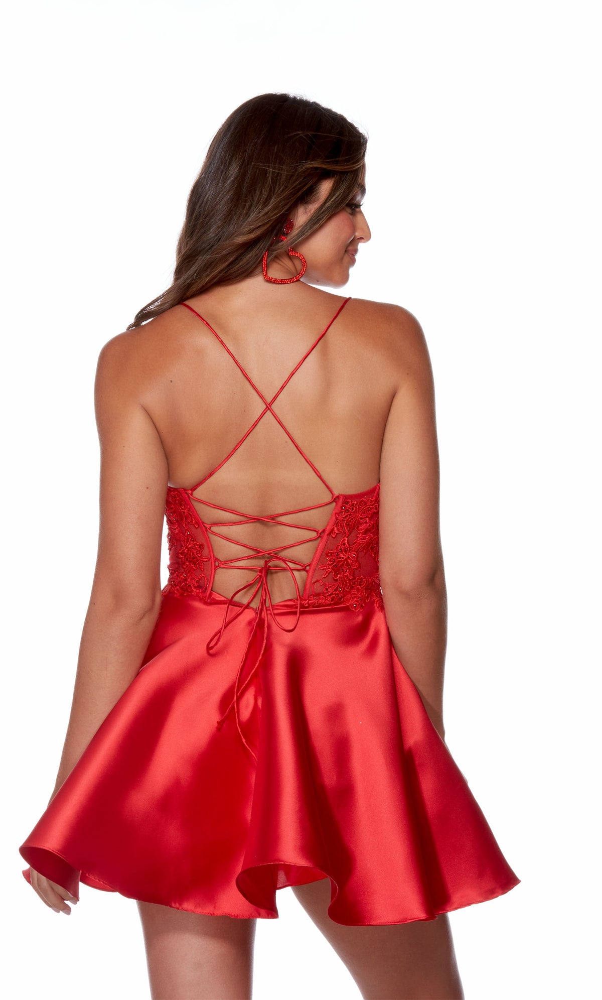 A short red party dress, featuring a plunging neckline, sheer corset top, and a strappy open back, by designer Alyce Paris.