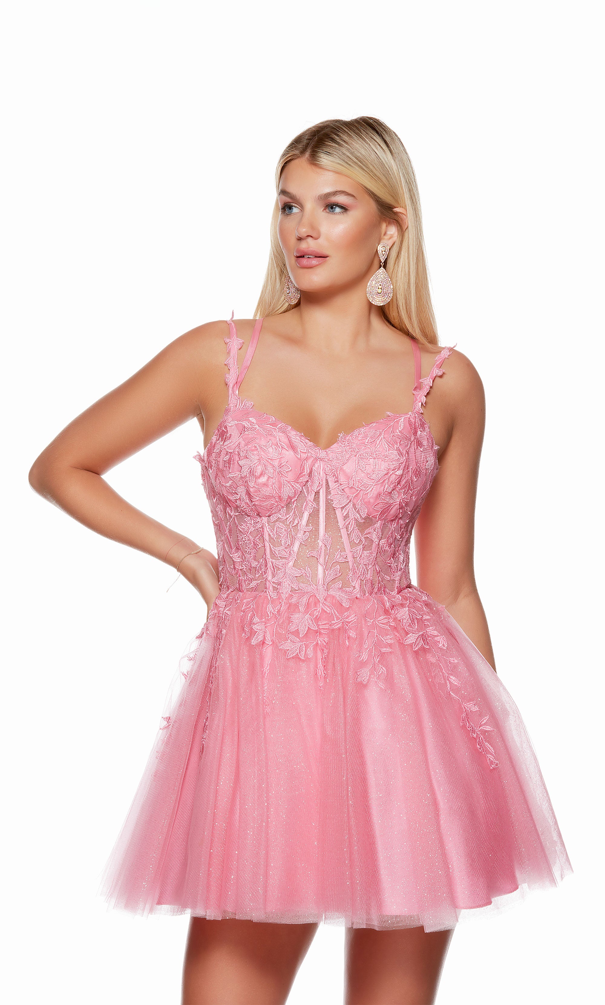 A pink sparkly corset dress, featuring a sweetheart neckline, sheer bodice with lace appliques, and a lace up back, perfect for homecoming.
