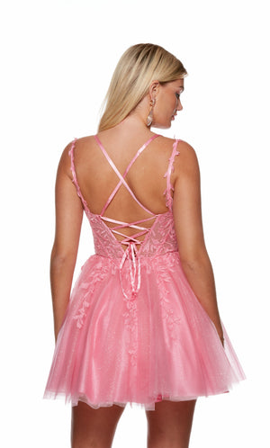 A pink sparkly corset dress, featuring a sweetheart neckline, sheer bodice with lace appliques, and a lace up back, perfect for homecoming.