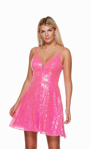 A hot pink sequin short formal dress with a plunging neckline and a V shaped back, perfect for homecoming.
