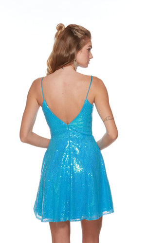 A turquoise blue sequin short formal dress with a plunging neckline, an A-line silhouette, and a V shaped back.