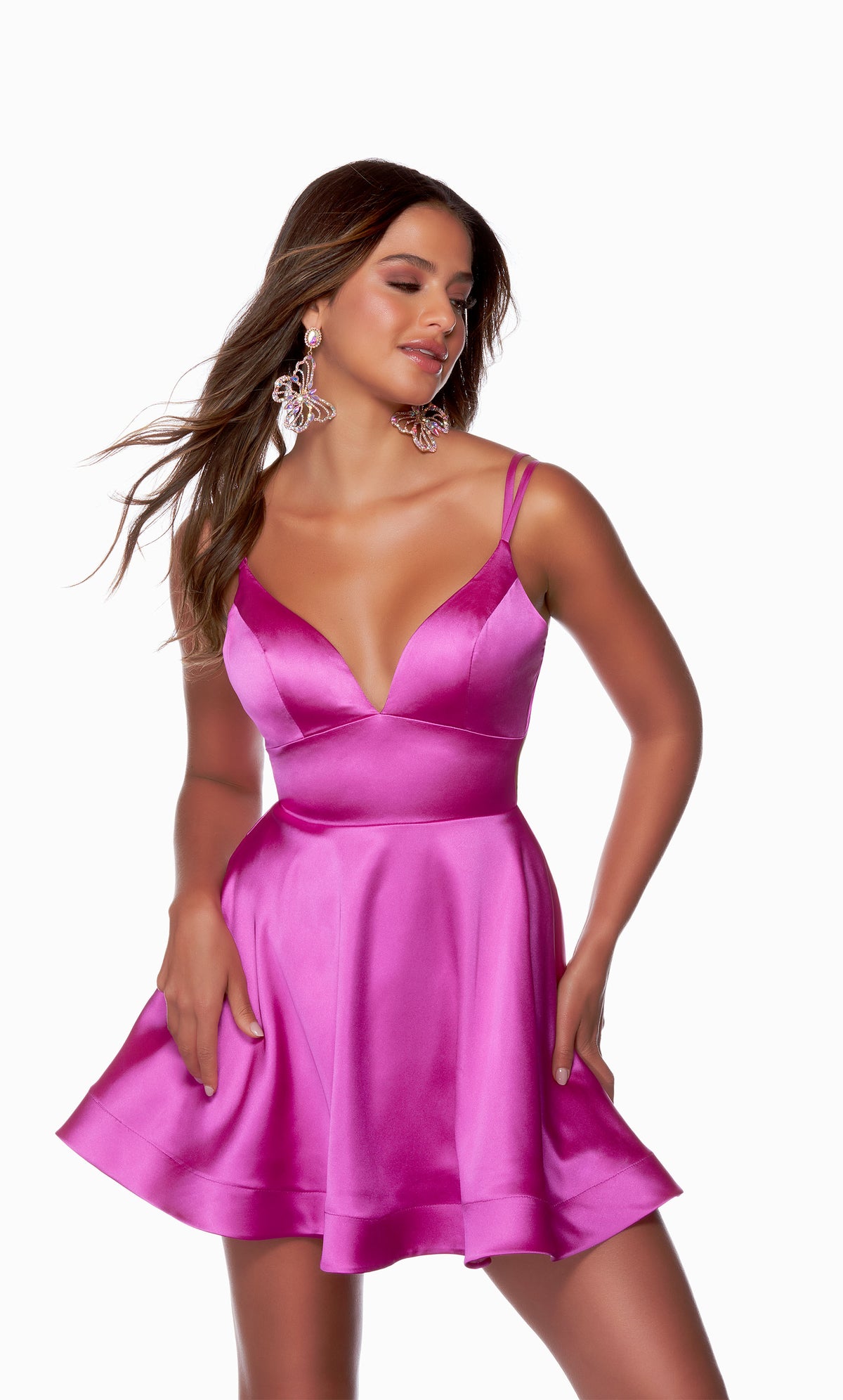 A V-neck, short satin homecoming dress with double spaghetti straps and a strappy, lace-up back in the color neon purple.