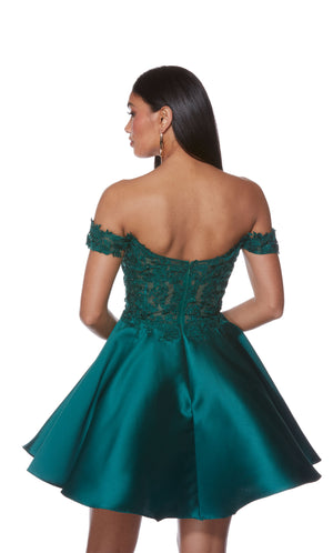 A pine green, Mikado flare short party dress with a zip-up back and sheer corset bodice, adorned with floral lace appliques.