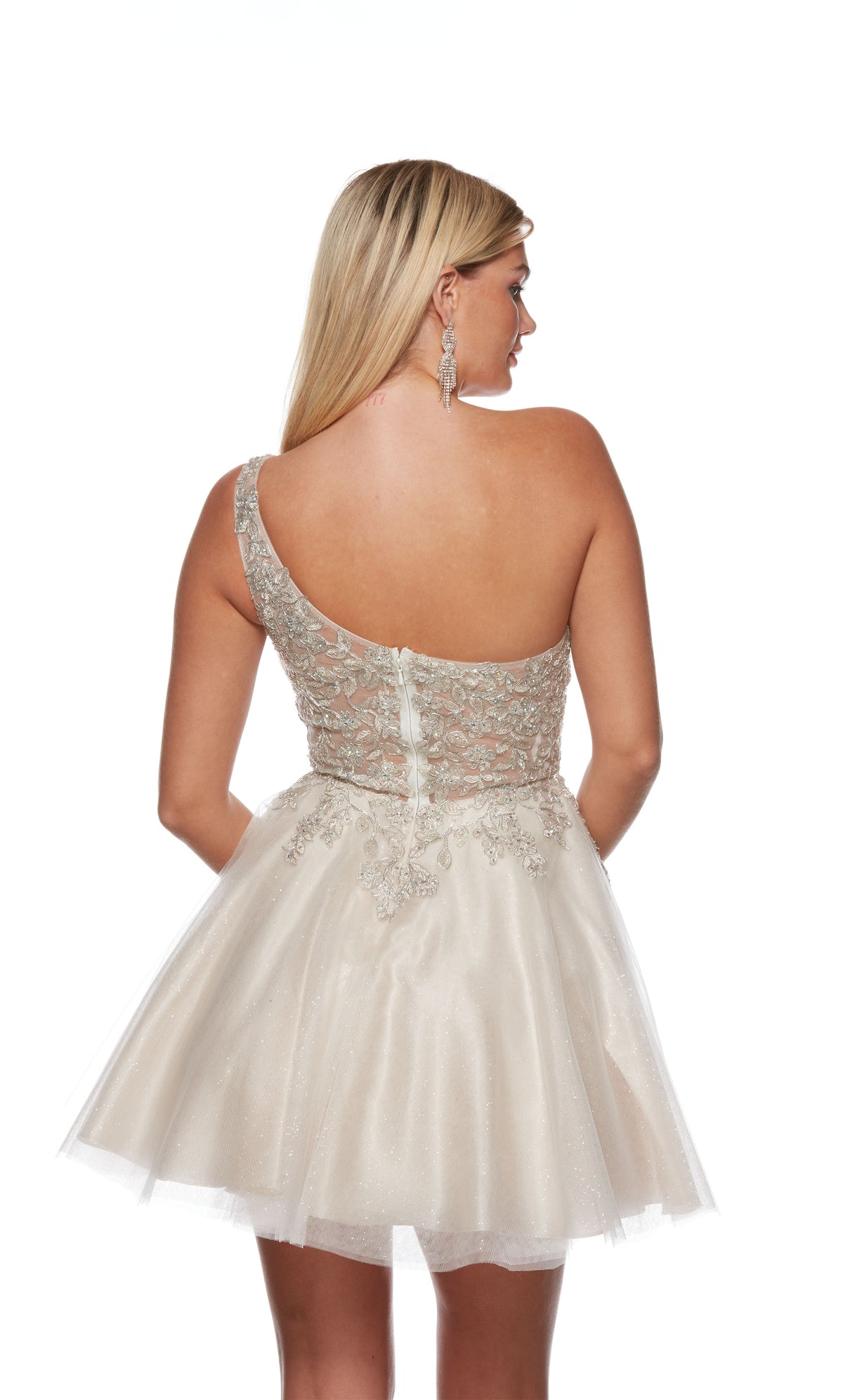 An ivory-champagne colored, one-shoulder short formal dress with a delicate lace bodice and a full tulle skirt.