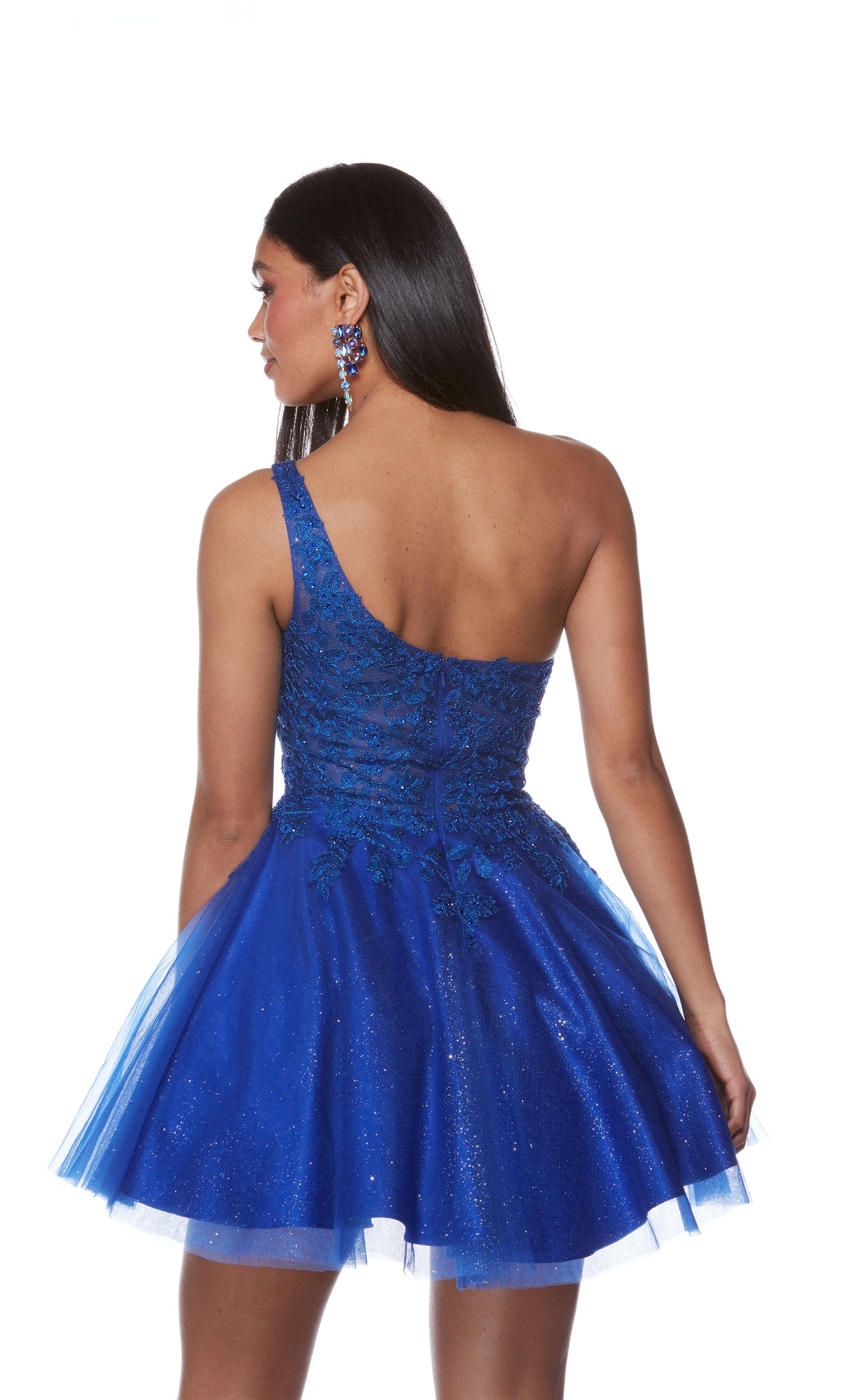 A royal blue, one-shoulder short formal dress with a delicate lace bodice and a flared glitter tulle skirt for the perfect touch of sparkle.