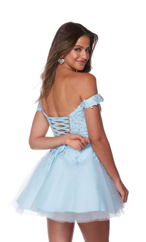 A dreamy light blue, off-the-shoulder homecoming dress adorned with delicate lace overlay, highlighting a lace-up back and full glitter tulle skirt.