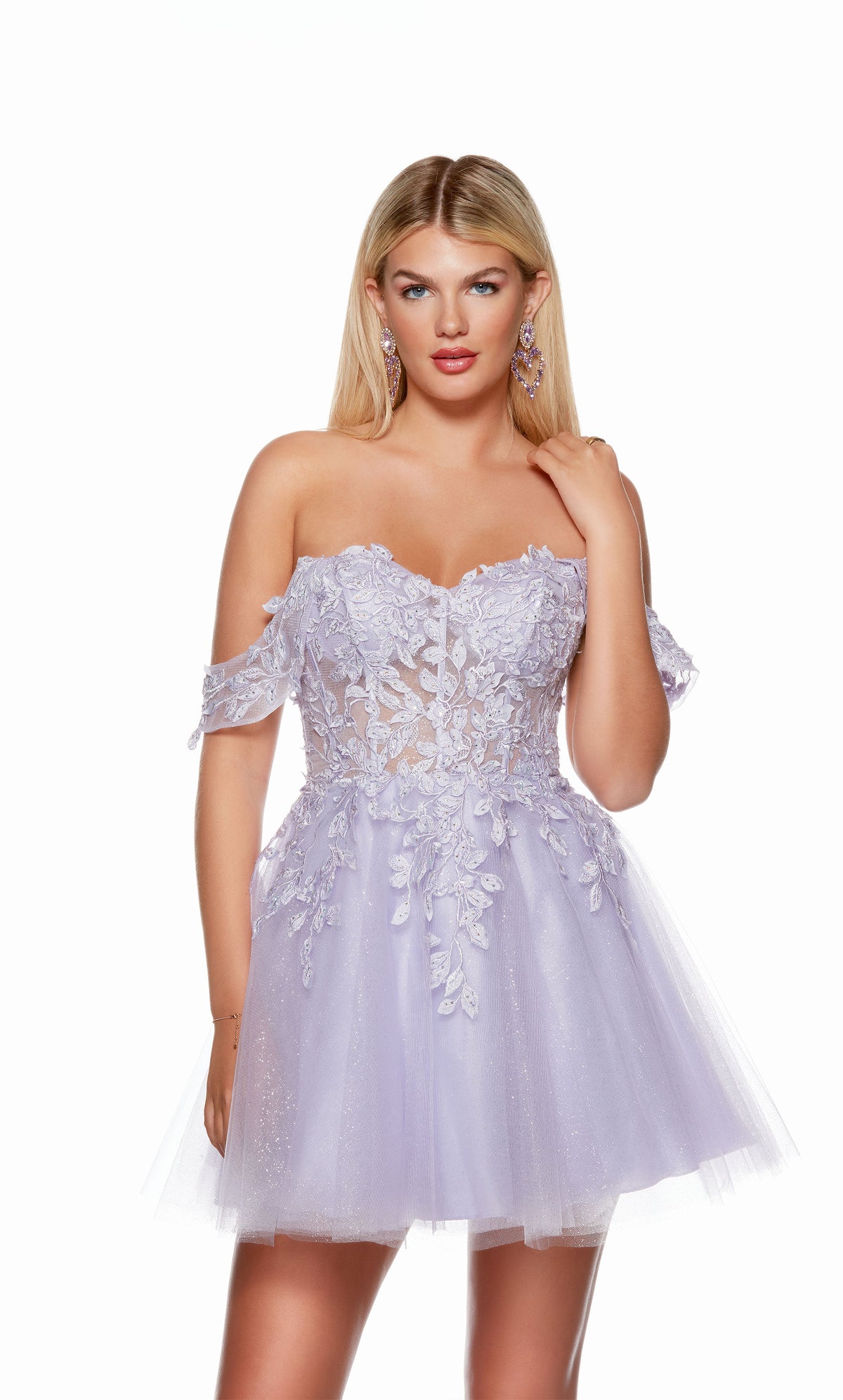 A playful, tiered tulle dress in a soft pastel shade, boasting an off-the-shoulder neckline and a sheer corset bodice adorned with floral appliques for a whimsical touch.
