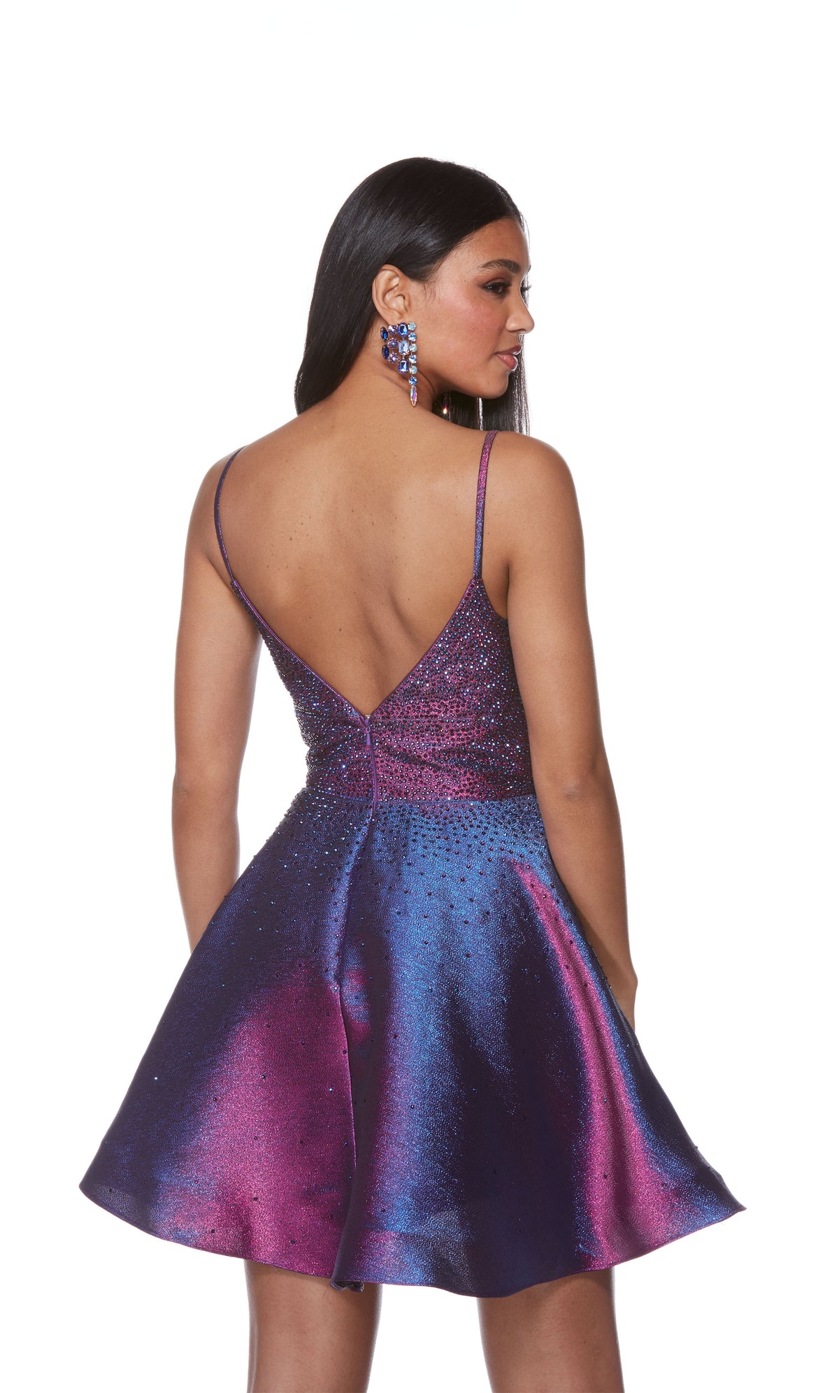A sparkly metallic short homecoming dress boasting an open back, jewel embellished bodice, and a flirty flared skirt. The color is an iridescent blue-ish purple called blueberry.