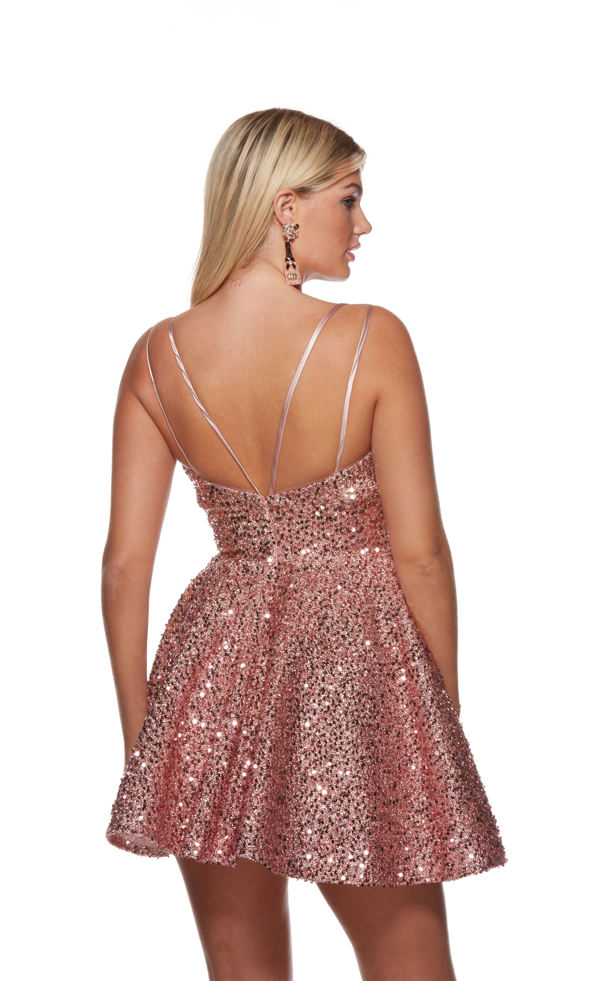A light mauve, sequin short formal dress highlighting a V neckline, double spaghetti straps, and flared A-line skirt. Shop our latest collection of gorgeous designer dresses by ALYCE Paris.