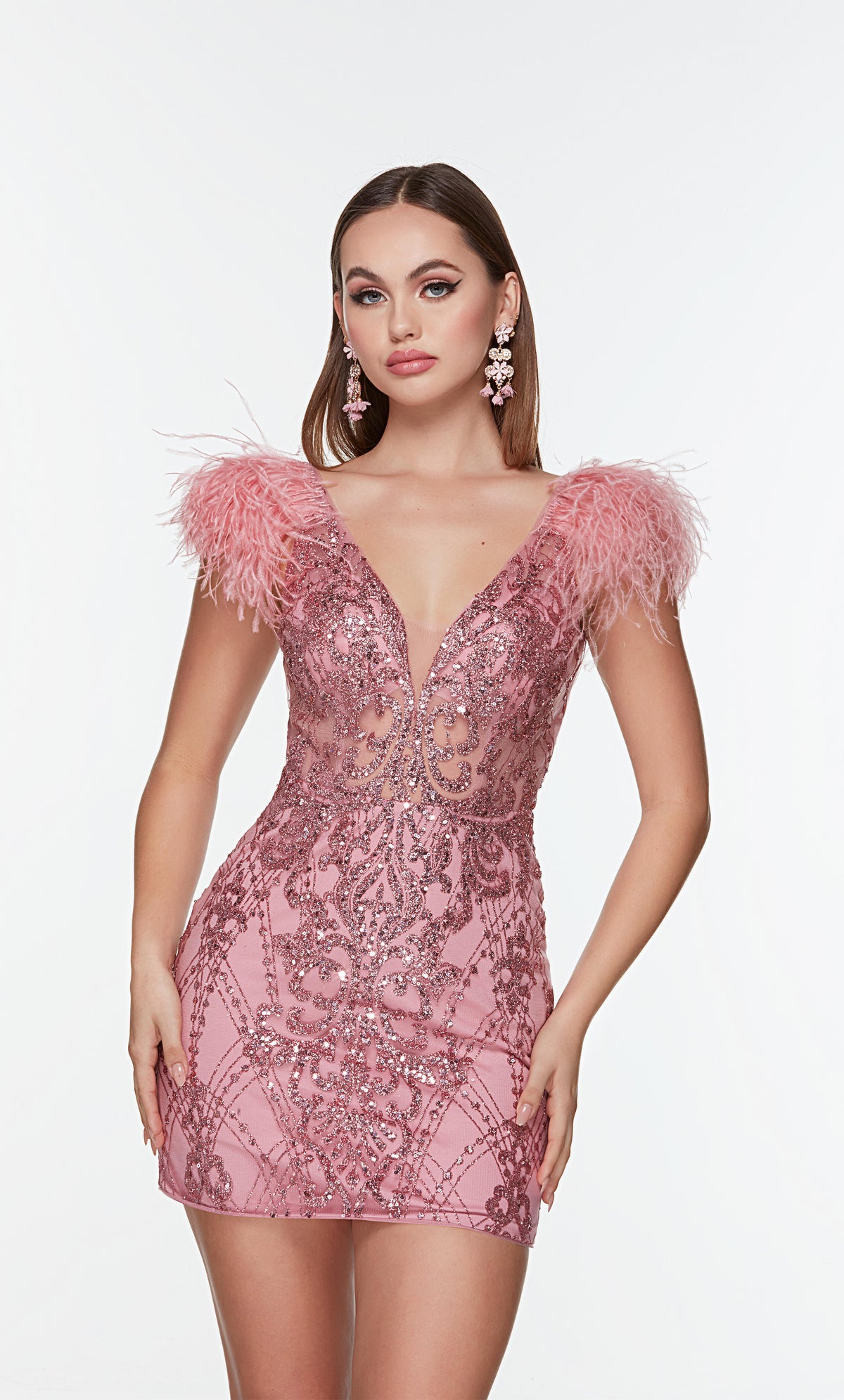 Pink mini dress with a plunging neckline, sheer bodice, and feather accents. 
