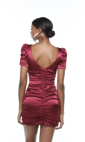 Burgundy cute homecoming dress with a zip up back, short sleeves, and ruching detail.