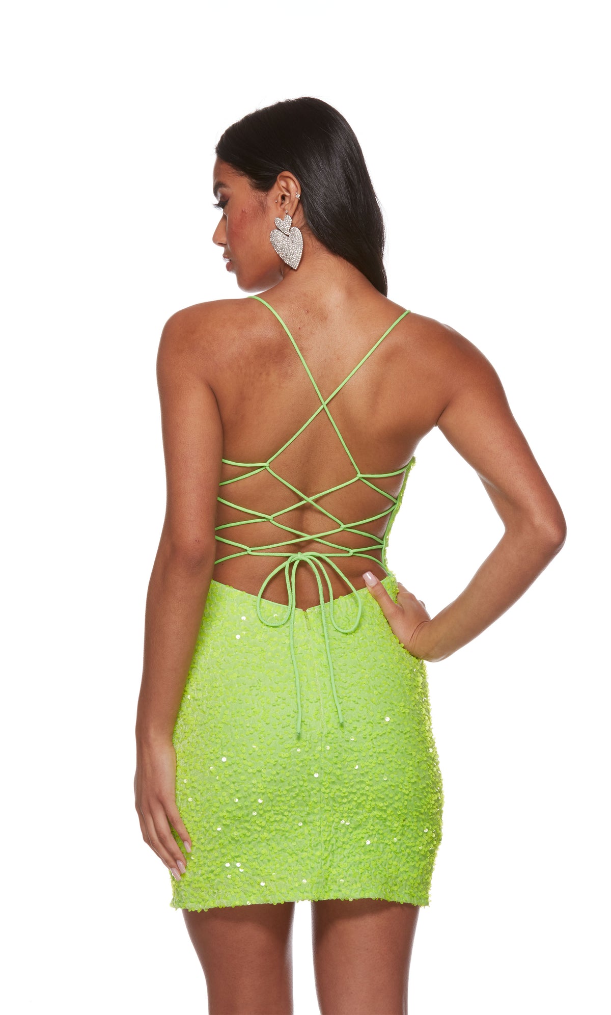An iridescent, neon green sequin mini dress with a strappy back.