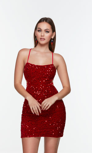 Red sequin mini dress with side cutouts and a scoop neckline. 