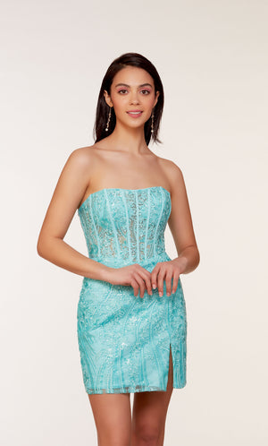 A short strapless corset dress with a sheer bodice adorned with an intricate lace overlay and a side slit. The dress was created in a refreshing turquoise-like blue called blue radiance.