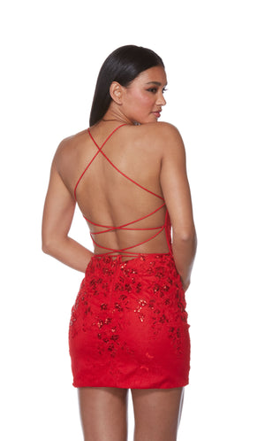 A stunning red short corset dress highlighting a sweetheart neckline and sheer bodice. The lace overlay and sequin detailing add the perfect touch to finish off the look.