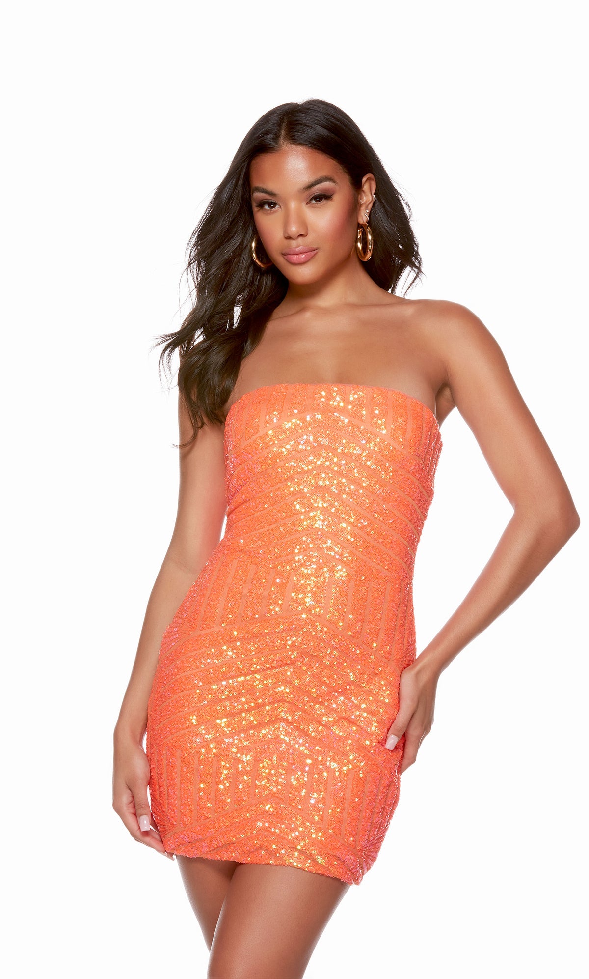 A hot coral shimmering sequin homecoming dress with a fitted silhouette and a strapless neckline. Check out our latest collection of gorgeous designer dresses by ALYCE Paris.