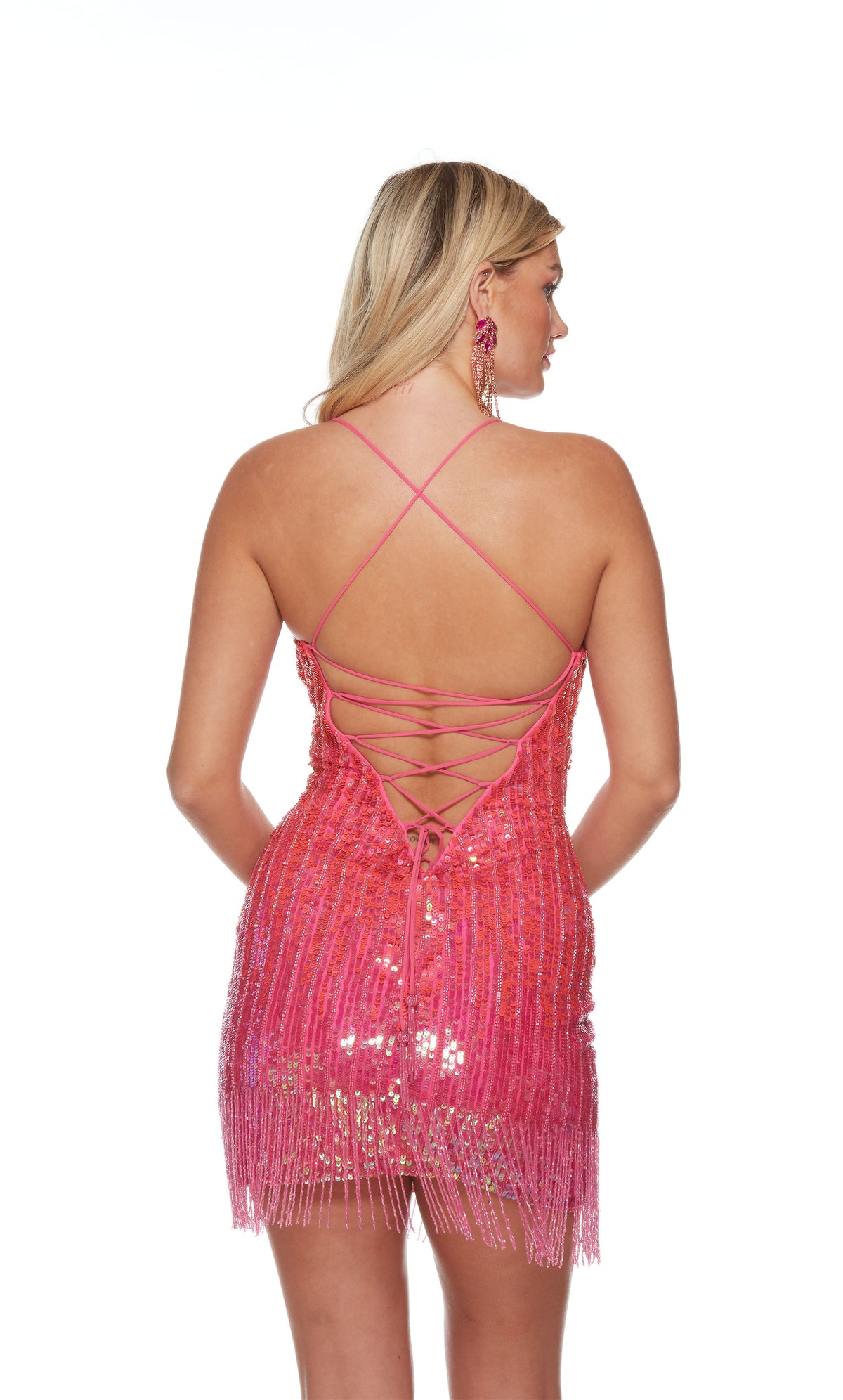 A hand-beaded short formal dress with a lace-up back, shimmery sequins, and beaded fringe, in a delightful light neon pink ombre color.