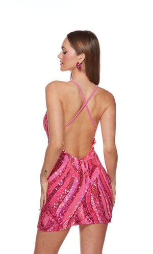 A patterned, hand-beaded short formal dress created from multi-tonal pink sequins. The dress has a low V-neckline and beaded, criss-cross straps on the back. Check out our latest collection of gorgeous designer dresses by ALYCE Paris.