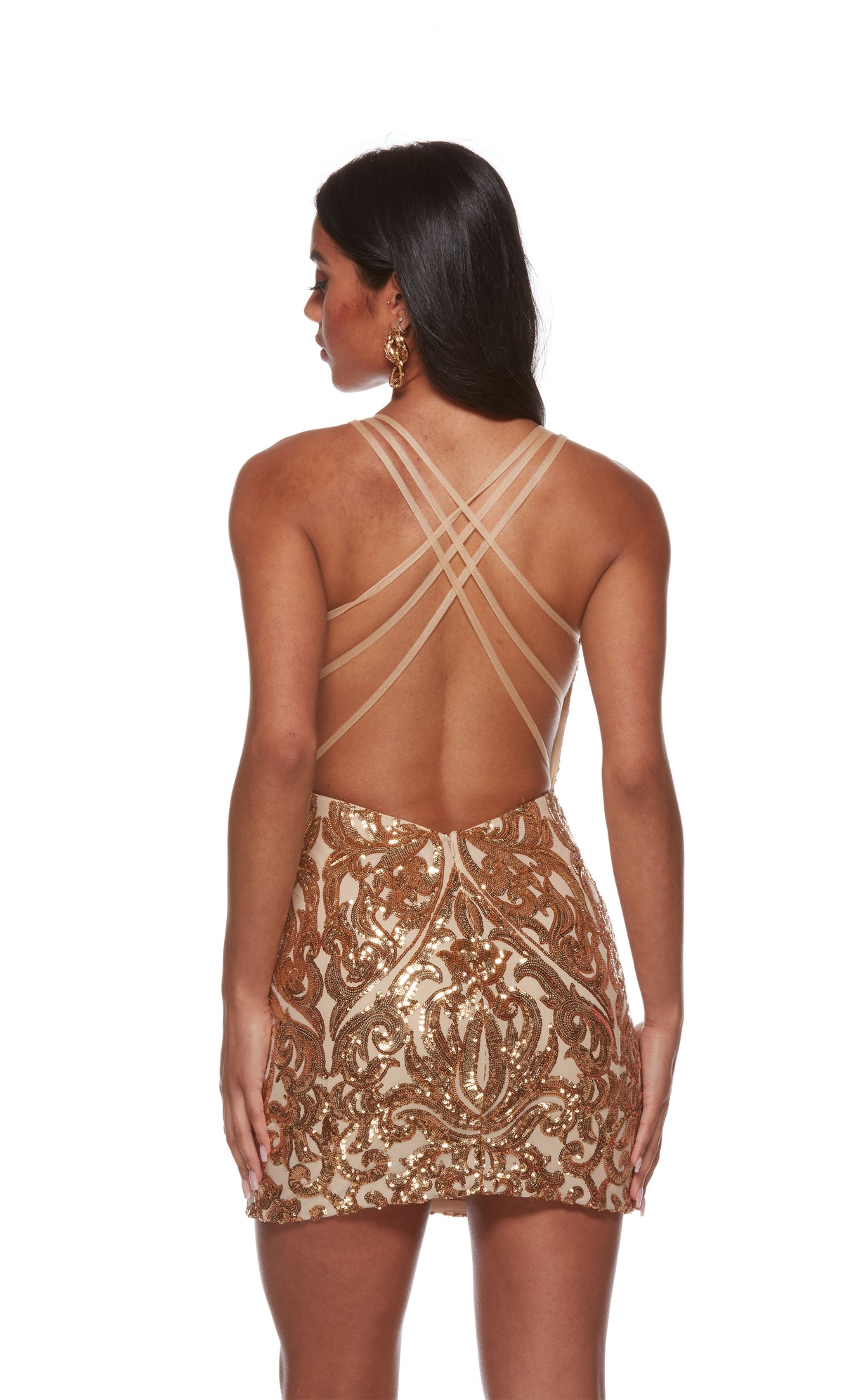 A vintage-inspired short gold formal dress in a shimmery sequin paisley pattern, featuring a strappy, open back and a fitted silhouette.