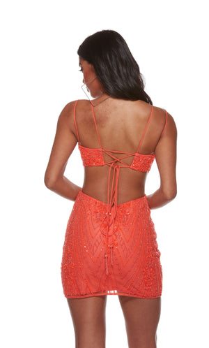 A hand-beaded shimmery mini dress with a lace-up back, side cut-outs, and a fitted silhouette in hot coral.